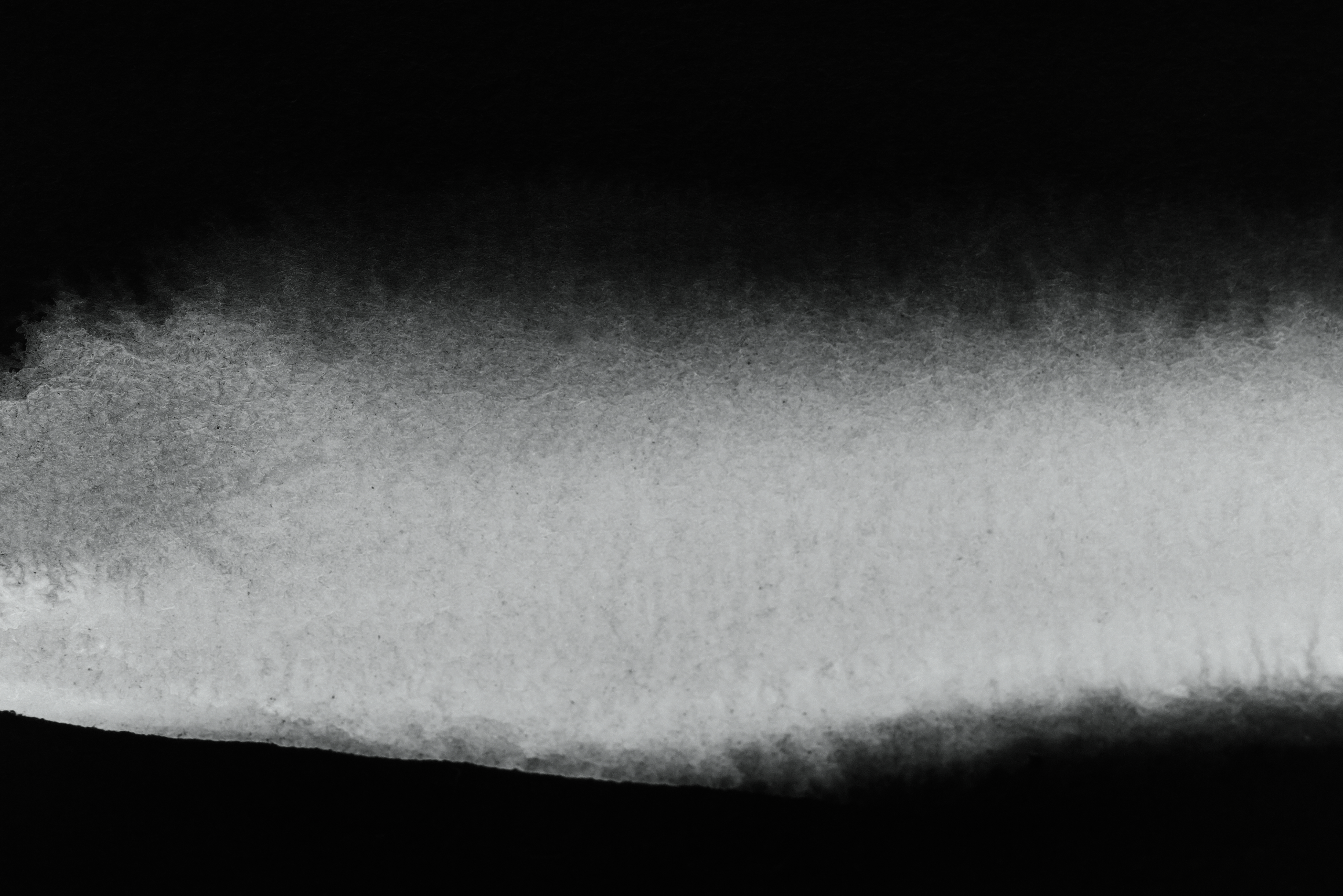 Grey mist against dark background